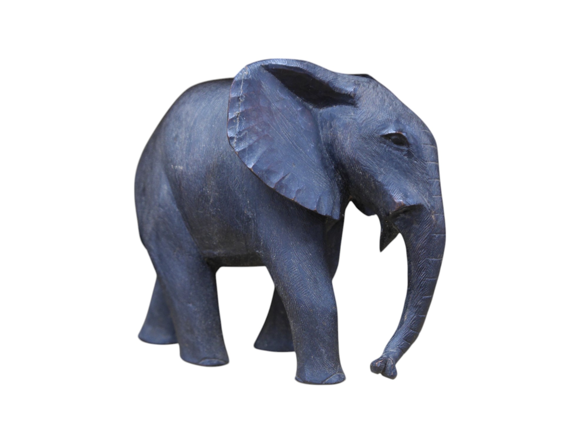 An African carved wood elephant, 27cm high. Condition - repaired section and tusks removed